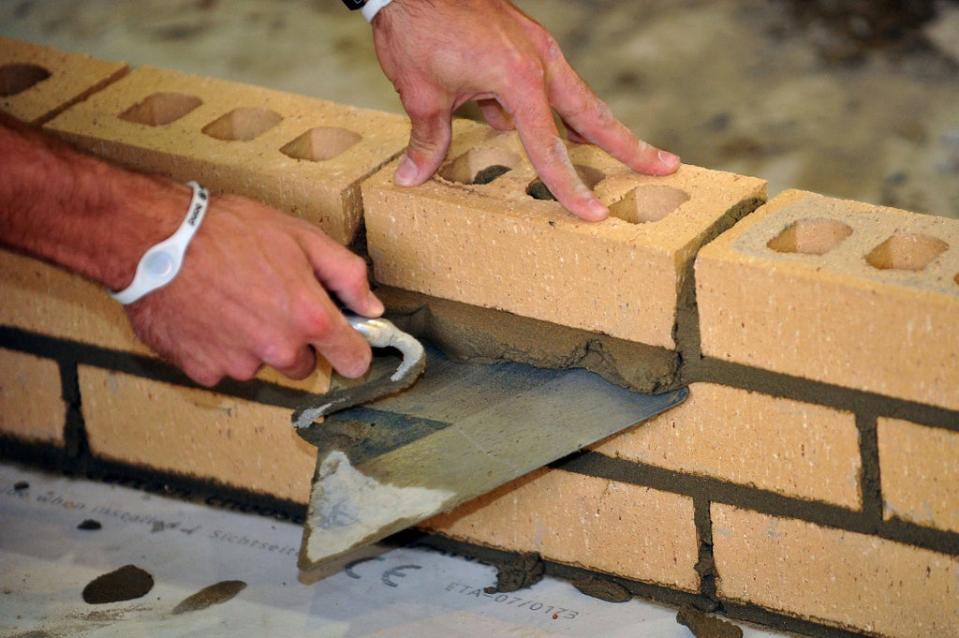 A trainee bricklayer (Ian Nicholson/PA) (PA Archive)