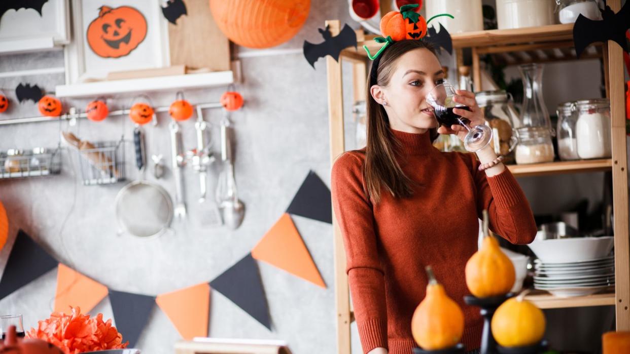 girl drinking wine on halloween