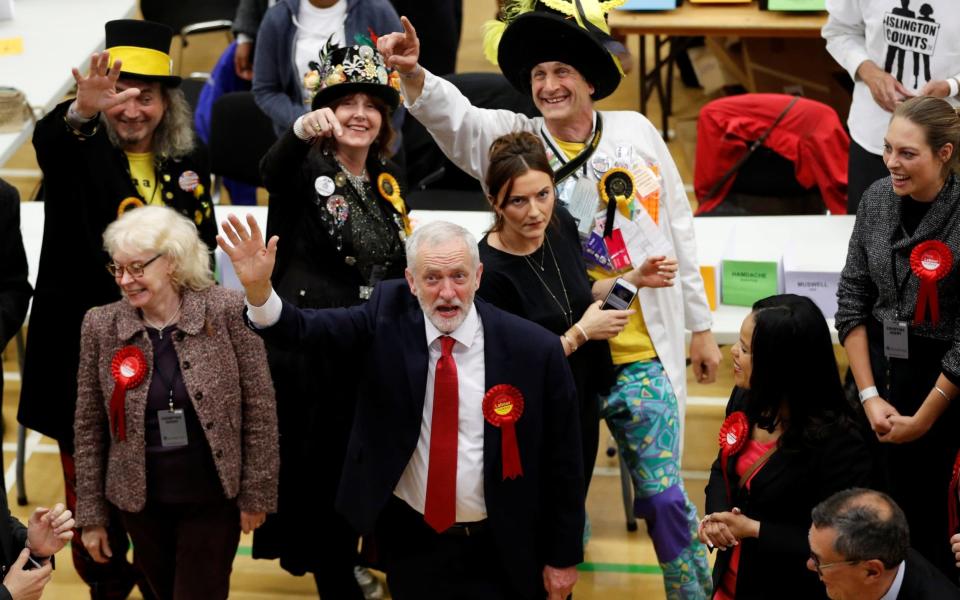 Jeremy Corbyn, leader of Britain's opposition Labour Party, waves as he arrives at a counting centre for Britain's general election in London - Credit: REUTERS/Darren Staples