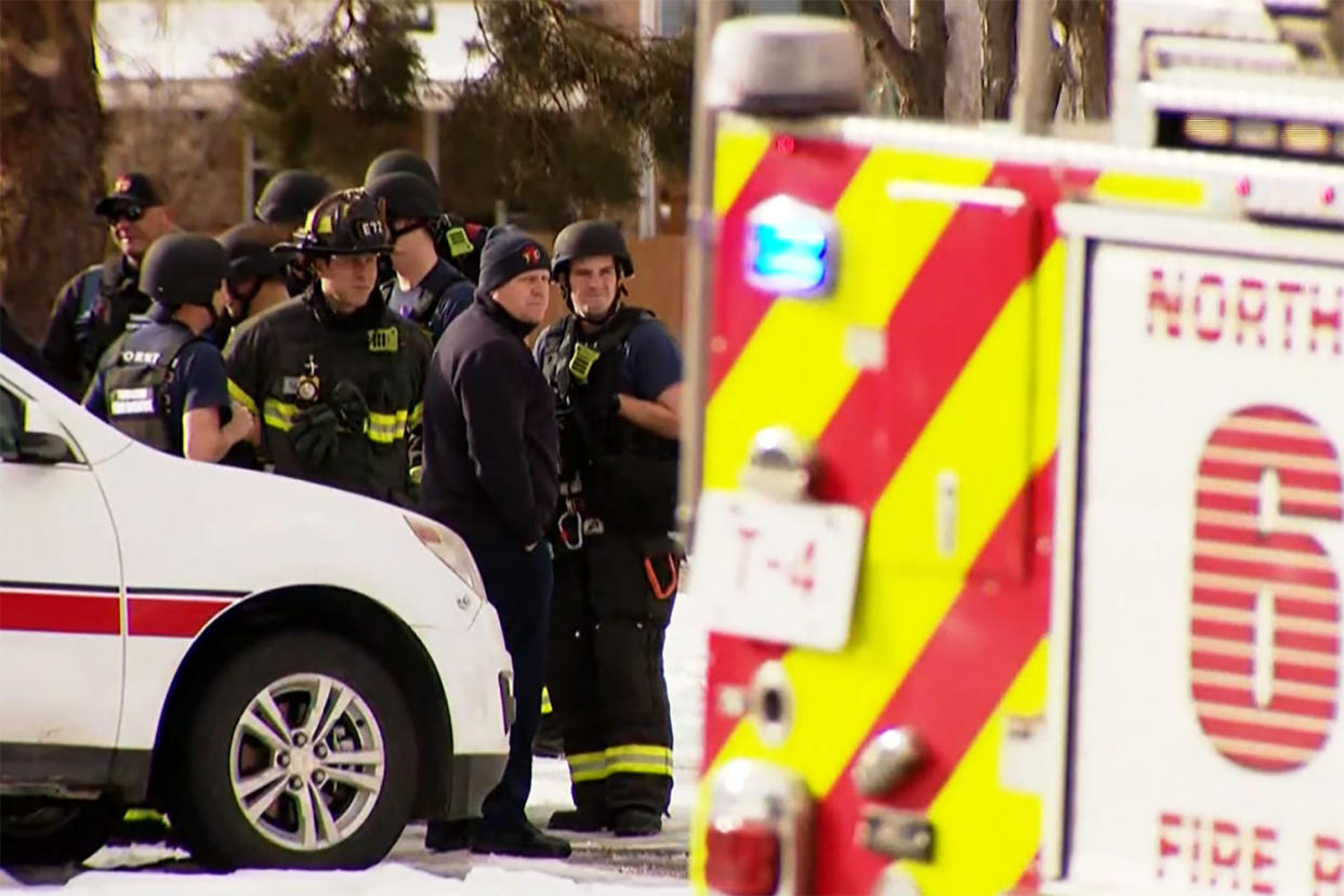 Emergency personnel investigate a murder-suicide at the Jehovah's Witness Kingdom Hall in Thornton, Colo., on Sunday. (KUSA)