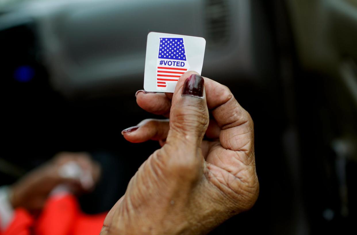 <span class="caption">Not every vote is counted equal.</span> <span class="attribution"><a class="link " href="https://www.gettyimages.com/detail/news-photo/sadie-janes-shows-off-her-voting-sticker-after-casting-her-news-photo/1204917605?adppopup=true" rel="nofollow noopener" target="_blank" data-ylk="slk:Joshua Lott/AFP via Getty Images;elm:context_link;itc:0;sec:content-canvas">Joshua Lott/AFP via Getty Images</a></span>