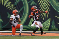 Cincinnati Bengals' Giovani Bernard (25) celebrates a touchdown against Cleveland Browns' Andrew Sendejo (23) during the second half of an NFL football game, Sunday, Oct. 25, 2020, in Cincinnati. (AP Photo/Bryan Woolston)