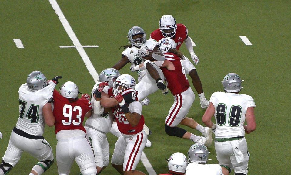 The USD defense stops a North Dakota running play on Saturday, Nov. 11, 2023.