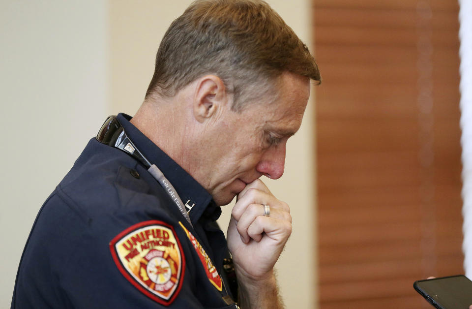 Unified Fire Authority's Jay Torgersen pauses while talking to media after a press conference in Draper, Utah, on Tuesday, Aug. 14, 2018. Draper Battalion Chief Matthew Burchett was killed on Monday night while fighting the largest blaze in California history, the Mendocino Complex fire north of San Francisco. (Jeffrey D. Allred/The Deseret News via AP)