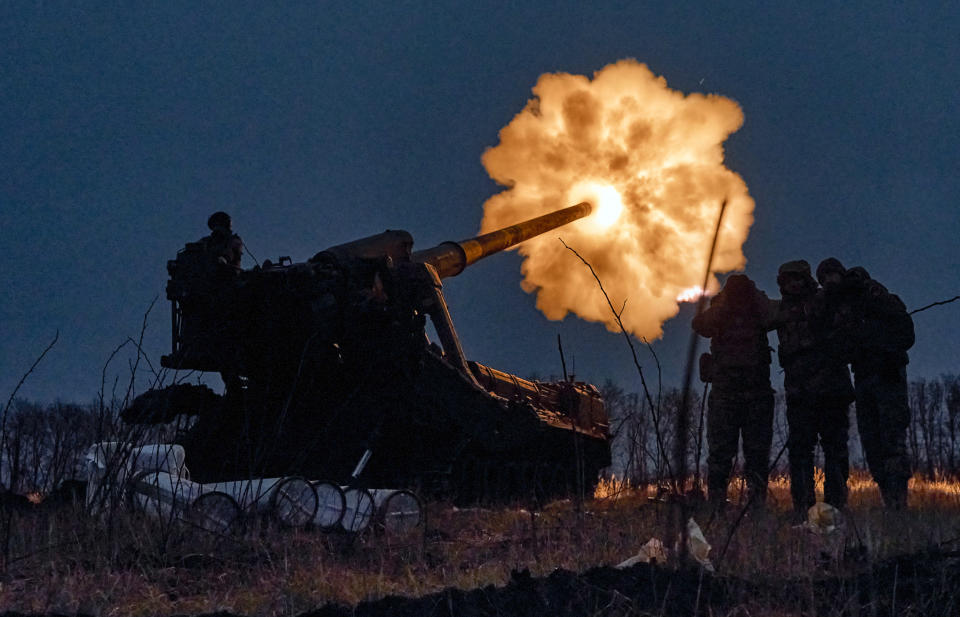 Ukrainian soldiers fire a Pion artillery system at Russian positions near Bakhmut, Donetsk region, Ukraine, Thursday, Dec. 15, 2022. (AP Photo/LIBKOS)