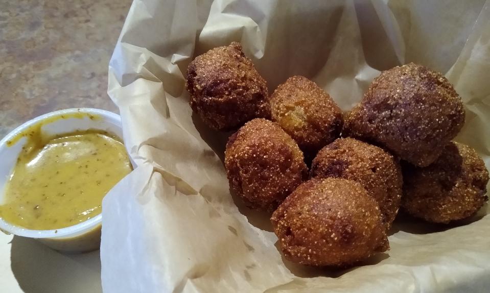 Hush puppies are served with a house-made honey mustard sauce at Great Oaks Tavern in Wadsworth.