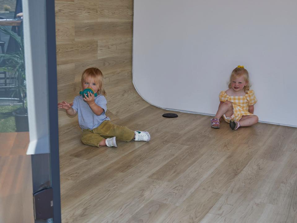 Two children sitting on the floor