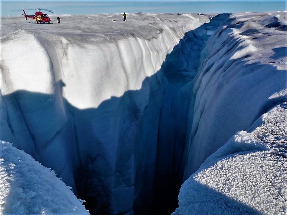 High rates of meltwater discharge combined with a thick and gently sloping ice sheet in Western Greenland gives rise to monster holes like this moulin. Alun Hubbard