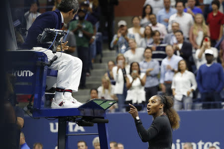 Serena Williams gestures to umpire Carlos Ramos (L) instead of shaking hands after her match. Geoff Burke-USA TODAY Sports