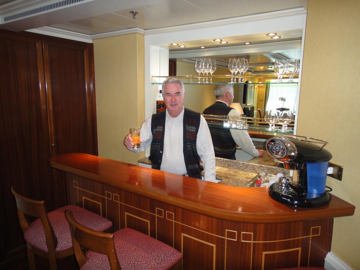 Rick DeFuria at the bar in a Royal Suite during one of his many travels with his life partner, Garry Jackson.