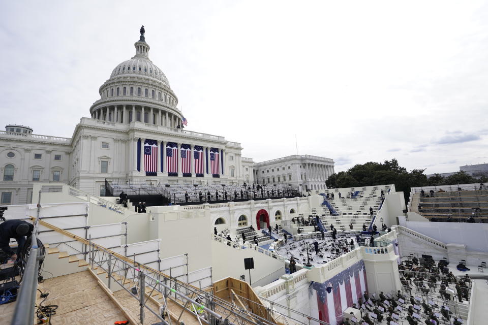 Preparations are made prior to a dress rehearsal for the 59th inaugural ceremony for President-elect Joe Biden and Vice President-elect Kamala Harris on Monday, January 18, 2021 at the U.S. Capitol in Washington. (AP Photo/Carolyn Kaster)