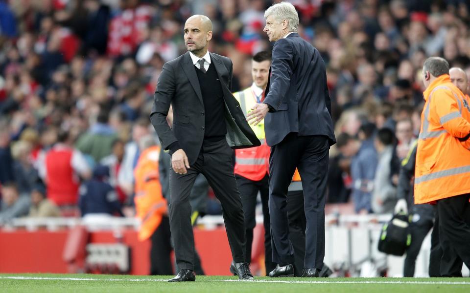 Pep Guardiola and Arsene Wenger (R) will go head to head on Sunday - Rex Features