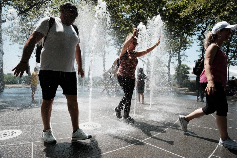 PHOTO: Children and adults cool off in a fountain in a lower Manhattan park on a hot afternoon in the city on July 06, 2023 in New York City. (Spencer Platt/Getty Images, FILE)