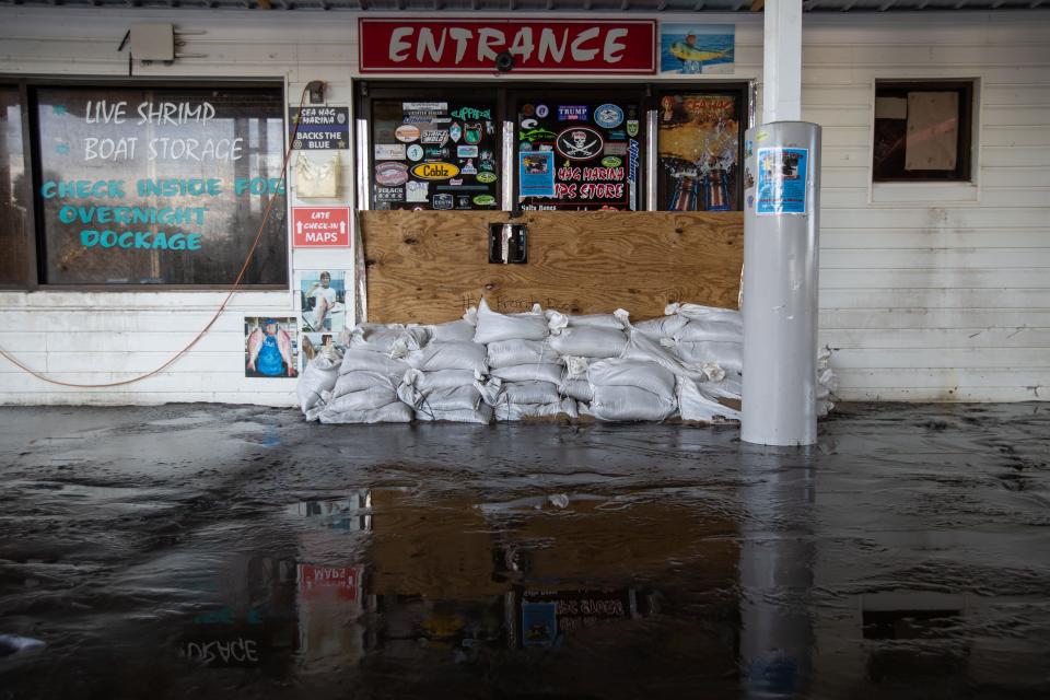 Several inches of sludge left by Hurricane Idalia covers the ground of Sea Hag Marina in Steinhatchee, Fla. on Wednesday, Aug. 30, 2023.