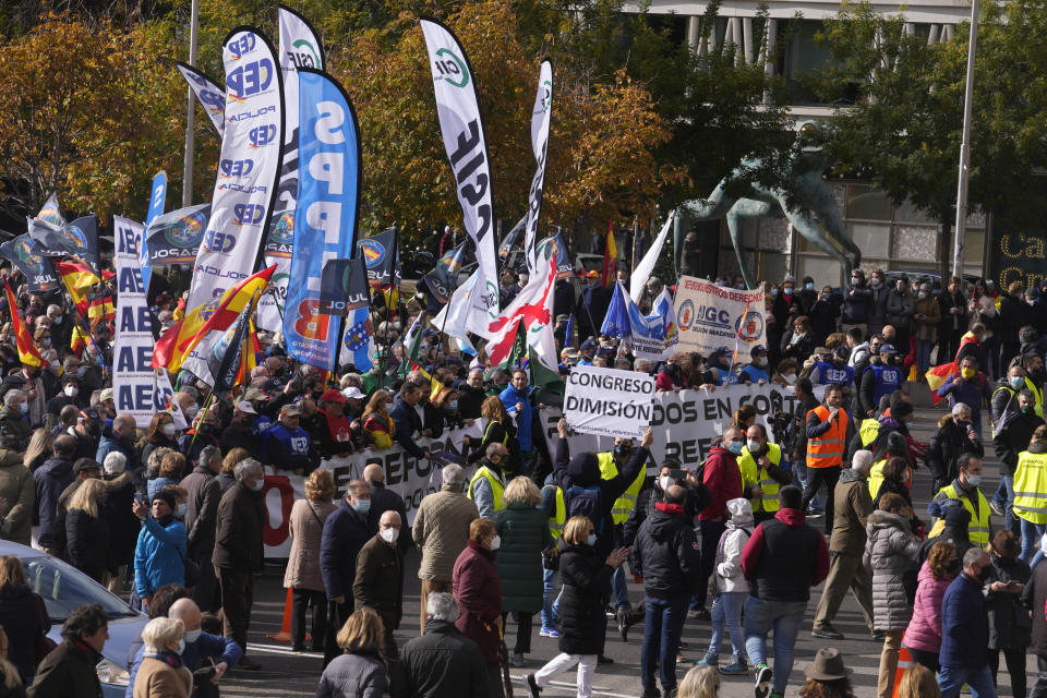 Police march during a protest in Madrid, Spain, Saturday, Nov. 27, 2021. Tens of thousands of Spanish police officers and their supporters rallied in Madrid on Saturday to protest against government plans to reform a controversial security law known by critics as the “gag law.” (AP Photo/Paul White)