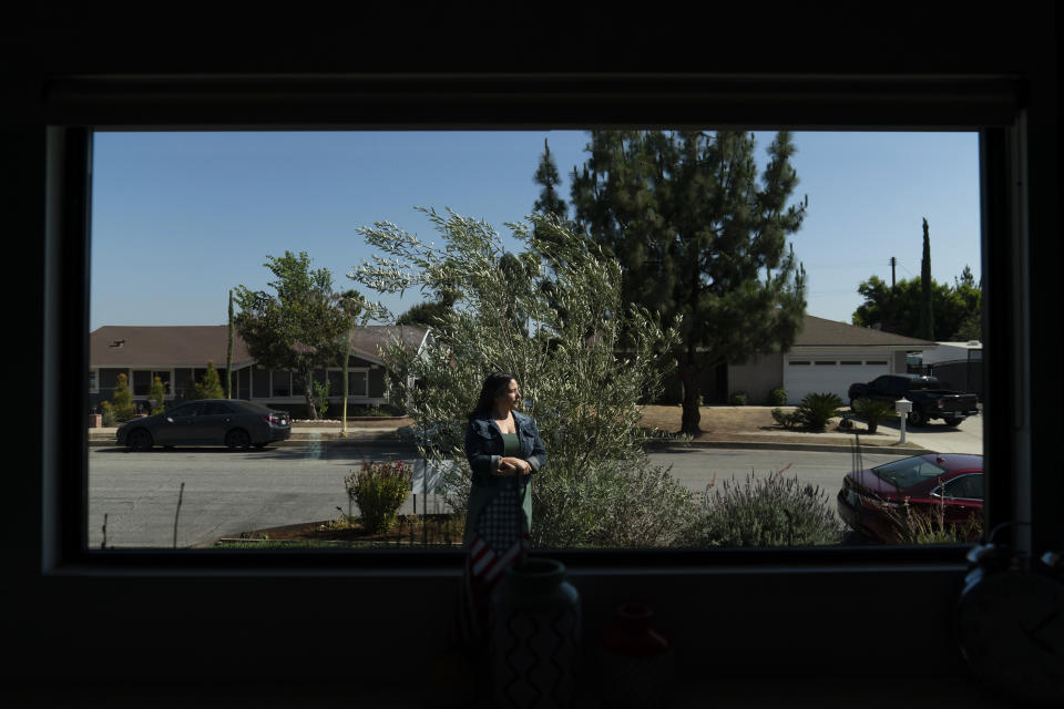 Stacy Cordova, whose aunt was a victim of California's forced sterilization program that began in 1909, stands for a photo Monday, July 5, 2021, in Azusa, Calif. Cordova's aunt, Mary Franco, was sterilized when she was 13 in 1934. Franco has since died, but Cordova has been advocating for reparations on her behalf. (AP Photo/Jae C. Hong)