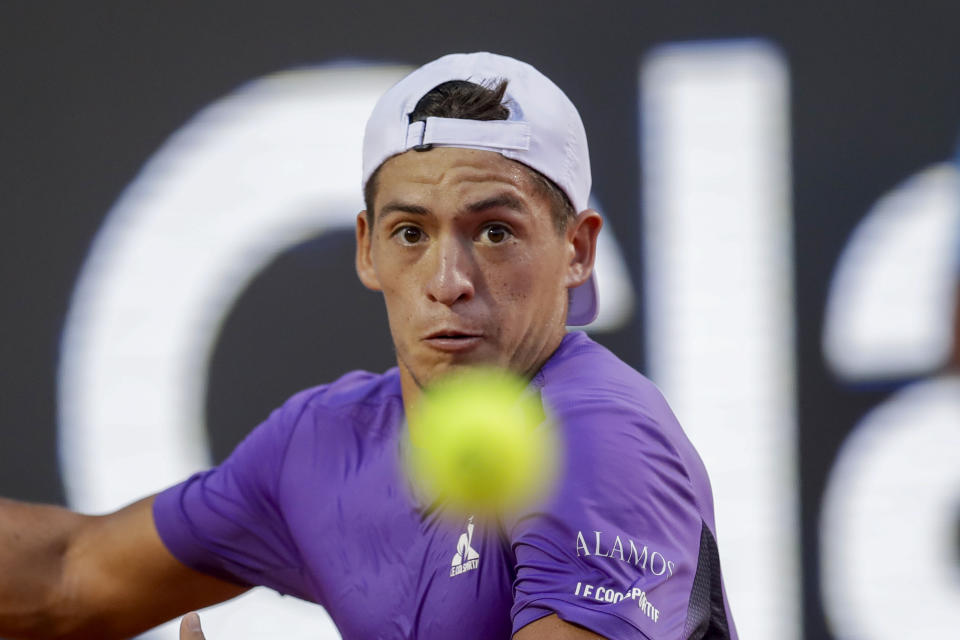 Sebastian Baez prepares to hit a return shot against Mariano Navone, both of Argentina, during the final match of the Rio Open tennis tournament in Rio de Janeiro, Brazil, Sunday, Feb. 25, 2024. (AP Photo/Bruna Prado)