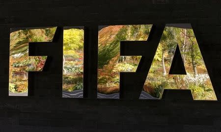 FIFA's logo is seen in front of its headquarters during a meeting of the FIFA executive committee in Zurich, Switzerland September 25, 2015. REUTERS/Arnd Wiegmann/Files