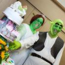 <div class="caption-credit"> Photo by: SWNS</div>The happy couple cut their wedding cake-topped with Shrek figurines, of course!