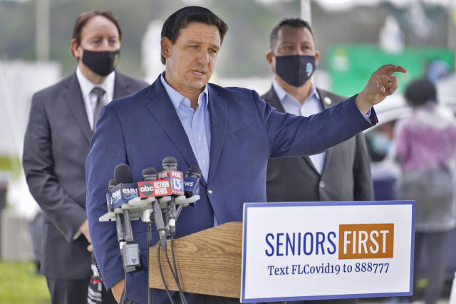 Florida Gov. Ron DeSantis gestures as he speaks to the media at a coronavirus vaccination site at Lakewood Ranch Wednesday, Feb. 17, 2021, in Bradenton, Fla. (Chris O&#39;Meara/AP)