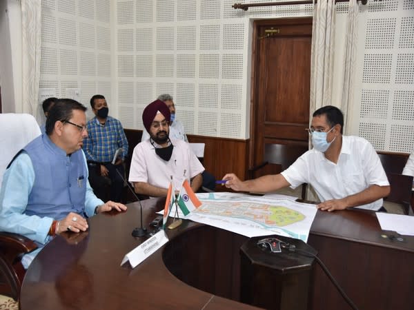 visuals from CM Pushkar Singh Dhami reviewing the development work.