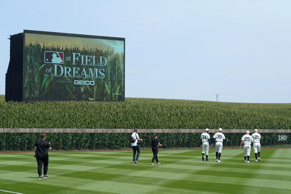 FILE - Chicago White Sox players walk on the field before a baseball game against the New York Yankees in Dyersville, Iowa, Thursday, Aug. 12, 2021. Major League Baseball returns to Iowa on Thursday, Aug. 11, 2022, when the Chicago Cubs play the Cincinnati Reds in the second “Field of Dreams” game at a throwback ballpark near where the 1989 movie was filmed. (AP Photo/Charlie Neibergall, File)