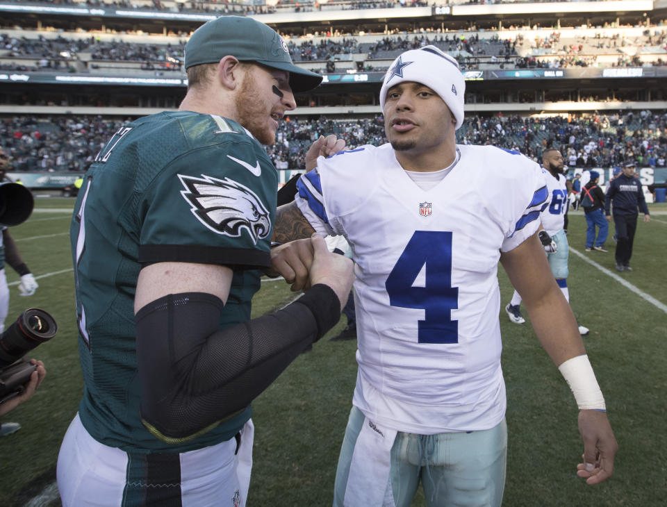 PHILADELPHIA, PA - JANUARY 1: Carson Wentz #11 of the Philadelphia Eagles hugs Dak Prescott #4 of the Dallas Cowboys after the game at Lincoln Financial Field on January 1, 2017 in Philadelphia, Pennsylvania. The Eagles defeated the Cowboys 27-13. (Photo by Mitchell Leff/Getty Images)