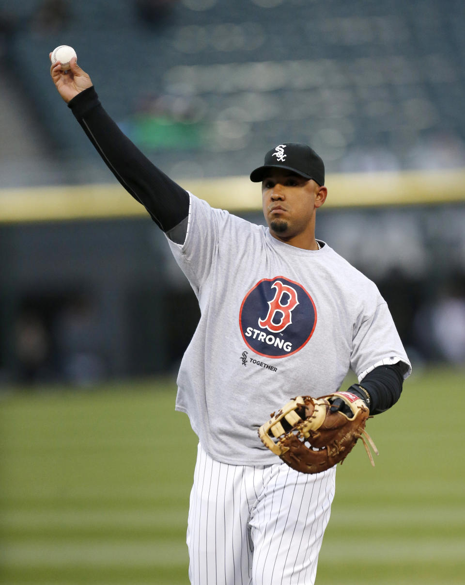 Chicago White Sox first baseman Jose Abreu wears a Boston Strong shirt while warming up for a baseball game against the Boston Red Sox on Tuesday, April 15, 2014, in Chicago, one year after the Boston Marathon bombings. (AP Photo/Charles Rex Arbogast)