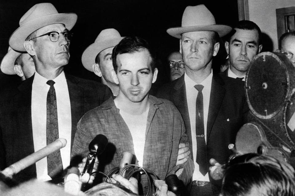 Assassination suspect Lee Harvey Oswald during a press conference after his arrest in Dallas – shortly before he too was shot dead (AFP via Getty Images)