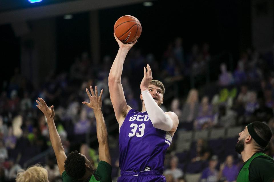 Former GCU center Asbjørn Midtgaard (33) shoots a basket at Grand Canyon University Arena on March 6, 2021. He is on the roster for the Phoenix Suns summer league team set to begin play on July 7.