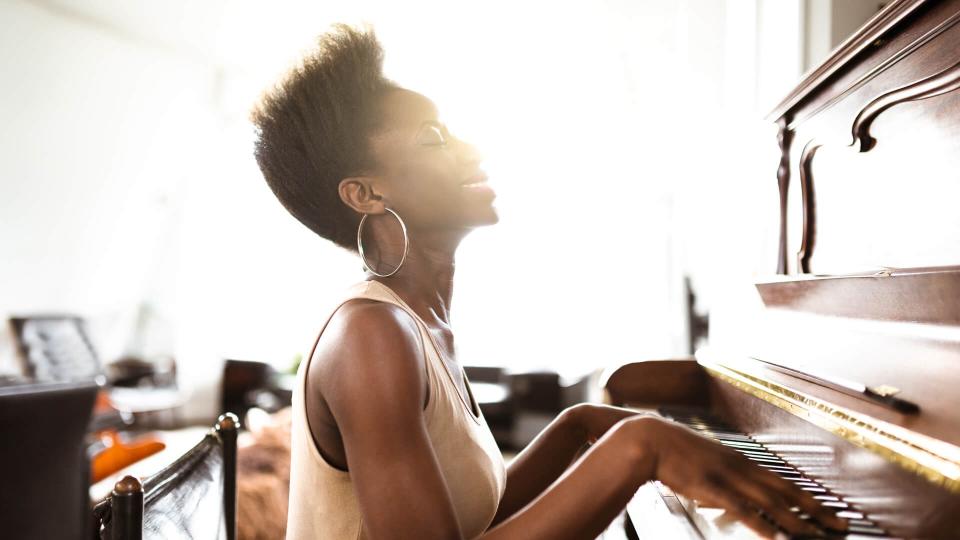 woman playing the piano.