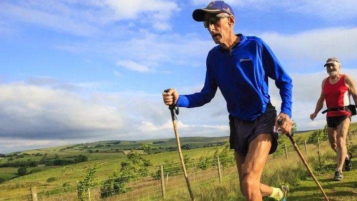 Joss Naylor running on a countryside path