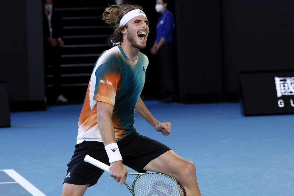 Stefanos Tsitsipas of Greece celebrates after defeating Benoit Paire of France in their third round match at the Australian Open tennis championships in Melbourne, Australia, Saturday, Jan. 22, 2022. (AP Photo/Hamish Blair)