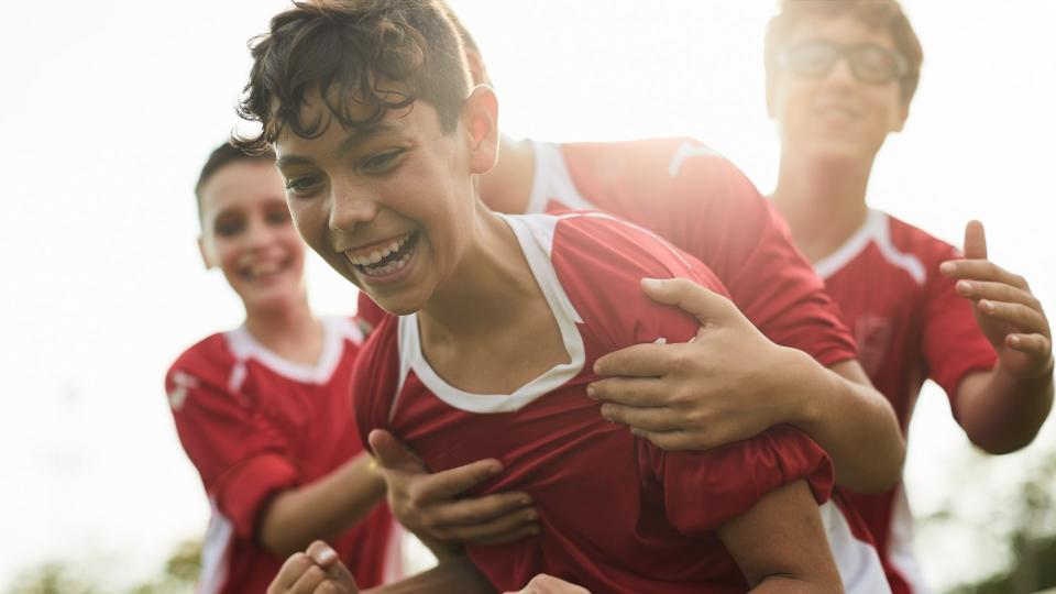 Lifestyle children training and playing soccer.