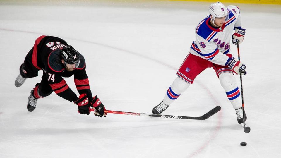 Carolina Hurricanesí Jaccob Slavin (74) defends New York Rangersí Ryan Strome (16) during the second period on Thursday, May 26, 2022 during game five of the Stanley Cup second round at PNC Arena in Raleigh, N.C.