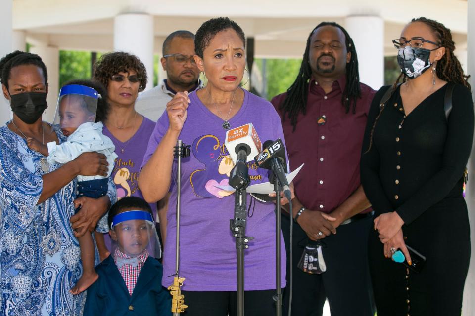 Community leaders with the Black Mothers Forum, Inc. and the Unity Collective speak at a news conference at the Wesley Bolin Plaza at the state Capitol in Phoenix on April 21, 2021.