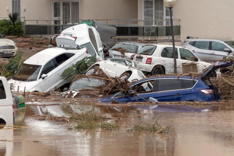 Cars are submerged in Majorca (EPA)