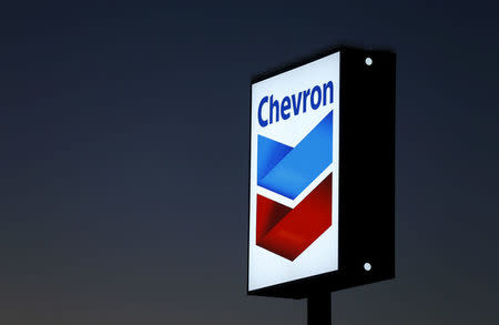 FILE PHOTO: A Chevron gas station sign is shown in Cardiff, California, January 25, 2016. REUTERS/Mike Blake/File Photo