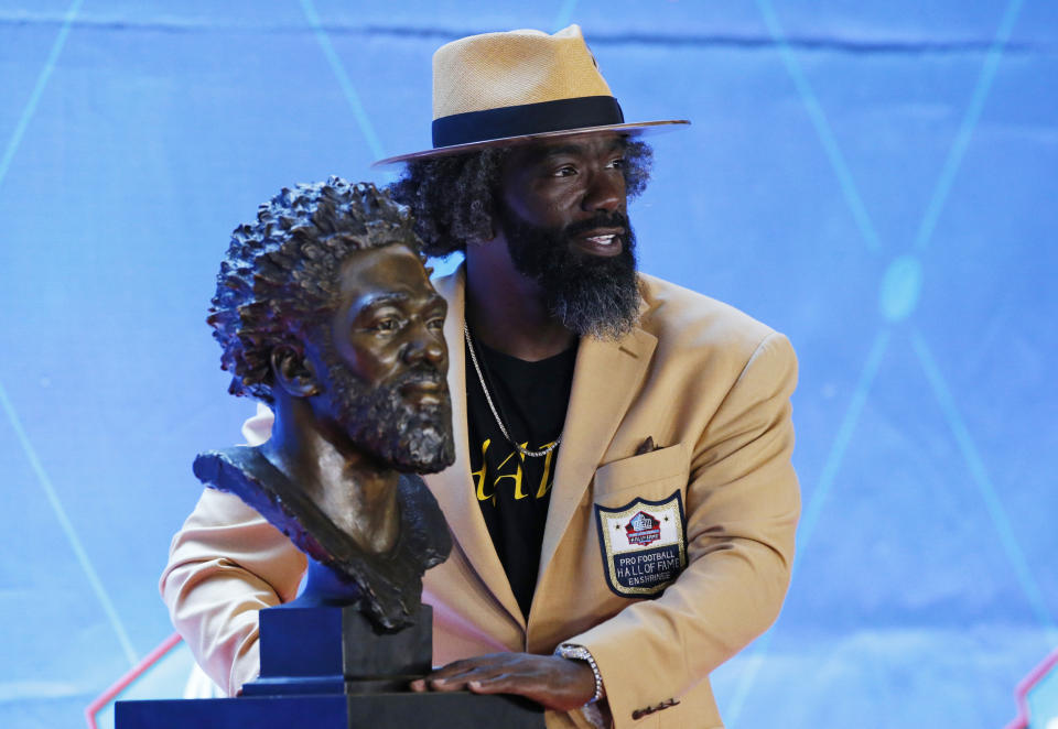 Ed Reed poses with his Pro Football Hall of Fame bust. (AP)