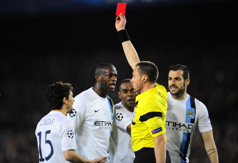 Manchester City players protest as referee Stephane Lannoy shows a red card to Manchester City's Pablo Zabaleta during a Champions League, round of 16, second leg, soccer match between FC Barcelona and Manchester City at the Camp Nou Stadium in Barcelona, Spain, Wednesday March 12, 2014. (AP Photo/Manu Fernandez)