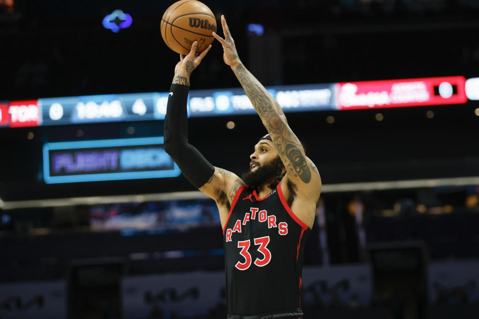 Toronto Raptors guard Gary Trent Jr. shoots against the Charlotte Hornets during the first half of an NBA basketball game in Charlotte, N.C., Wednesday, Feb. 7, 2024. (AP Photo/Nell Redmond)