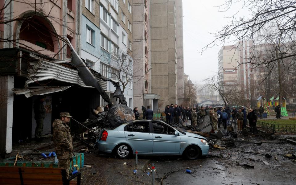 A view shows the site where a helicopter falls on civil infrastructure buildings in the town of Brovary - VALENTYN OGIRENKO/REUTERS