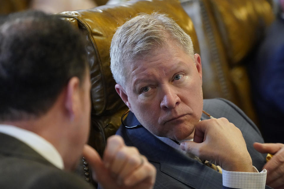 Sen. Bart Williams, R-Starkville, right, confers with Sen. David Parker, R-Olive Branch, as legislation that would expand the roles for state police and appointed judges inside the majority-Black and Democratic-led capital city of Jackson, is debated on the Chamber floor, Tuesday, March 7, 2023, at the Mississippi Capitol in Jackson. The majority-white and Republican-led Mississippi Senate passed the bill which now advances to the House. (AP Photo/Rogelio V. Solis)