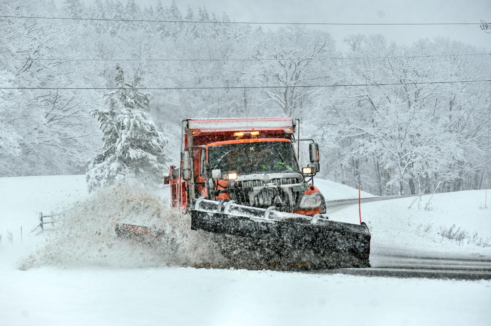 A snowplow clears the snow from Route 9, in Marlboro, Vt., as several inches of snow falls on Friday, April 16, 2021. More snow is forecast in portions of New England by mid-week, the National Weather Service said.