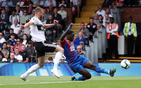 Crystal Palace's Jeffrey Schlupp (right) scores his side's first goal of the game during the Premier League match at Craven Cottage, London - Credit: PA