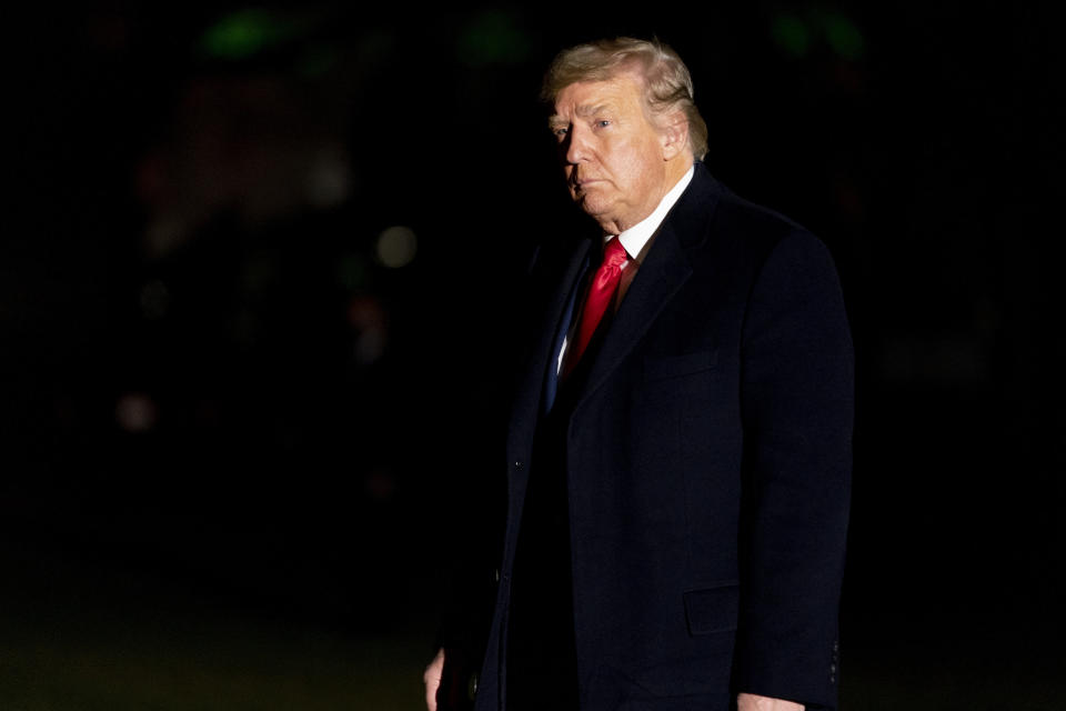 President Donald Trump arrives in the early morning hours, Tuesday, Jan. 5, 2021, at the White House in Washington, after returning from a rally in Dalton, Ga. (AP Photo/Andrew Harnik)