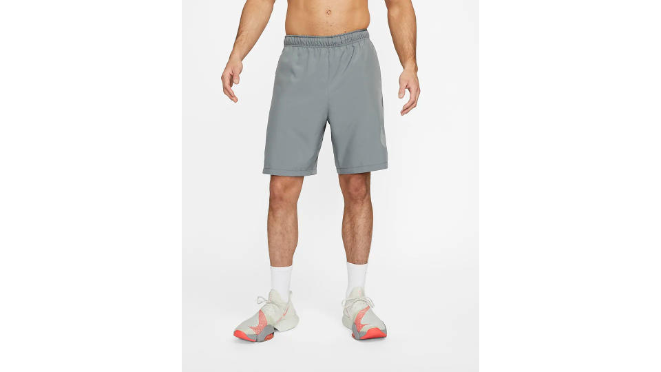 A model wearing a Nike Dri-FIT Men's 9 shorts.