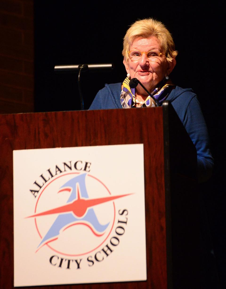 2023 Distinguished Alumni recipient Sarah Brown speaks during the induction ceremony on Monday, Oct. 2, 2023, in the Alliance High School auditorium.