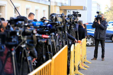 Journalists stand outside the United Nations office in Geneva waiting for the beginning of the Geneva IV conference on Syria, Switzerland, February 23, 2017. REUTERS/Pierre Albouy