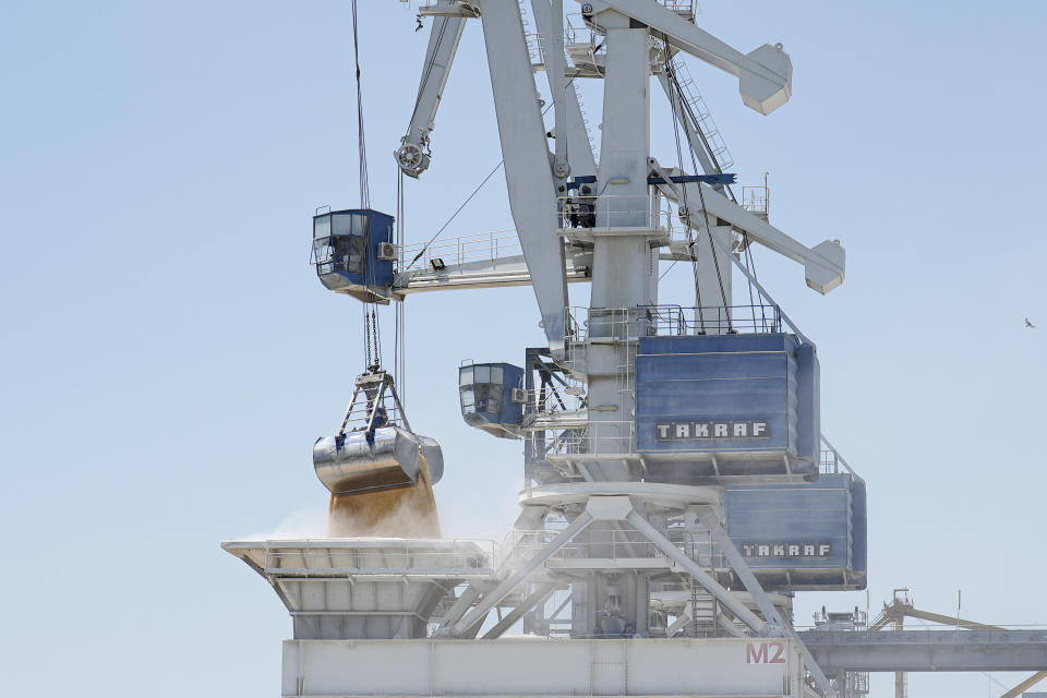 Cereals from Ukraine are unloaded from a barge in the Black Sea port of Constanta, Romania, Tuesday, June 21, 2022. While Romania has vocally embraced the ambitious goal of turning into a main hub for the export of agricultural products from Ukraine, economic experts and port operators in the country warn that it was much easier objective to set than to actually achieve. (AP Photo/Vadim Ghirda)